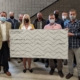 Builders Exchange of West Michigan presenting large donation check