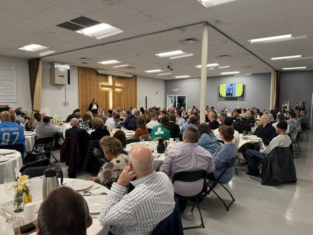 group of people listening to a speaker